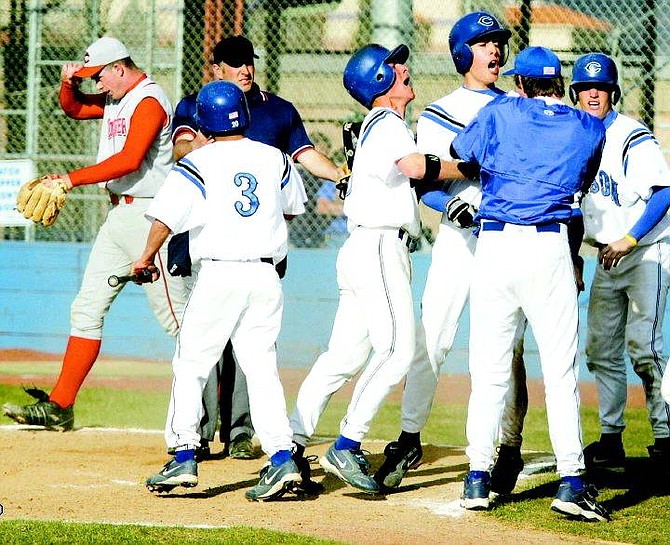 BRAD HORN/Nevada Appeal The Carson High school baseball team celebrates the game-leading run in the Senator&#039;s game against the Wooster Colts in Carson Thursday.