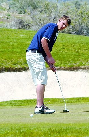Rick Gunn/Nevada Appeal CHS&#039; golfer Brice Crook watches a putt at the third hole at Genoa Lakes Tuesday afternoon.