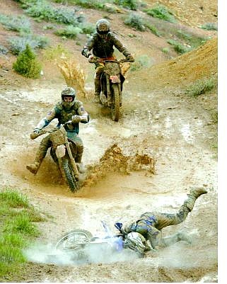 Riders try to avoid Dylan McFarlane, of Virginia City, Nev., after he crashed in a mud puddle at the bottom of a jump along the 19-mile round trip course during the Grand Prix at Virgina City on Sunday, May 1, 2005, in Virginia City, Nev. AP Photo Brad Horn/Nevada Appeal