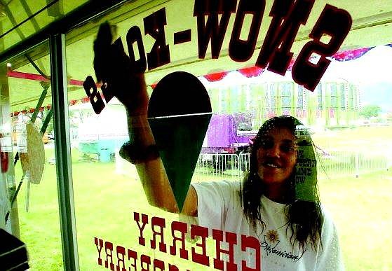 Appeal file photo Carnival worker Dameta Jones cleans the window of a food concession stand in this photo from last year&#039;s RSVP Spring Fun Fair. This year&#039;s fair opens at Mills Park today at 4 p.m.