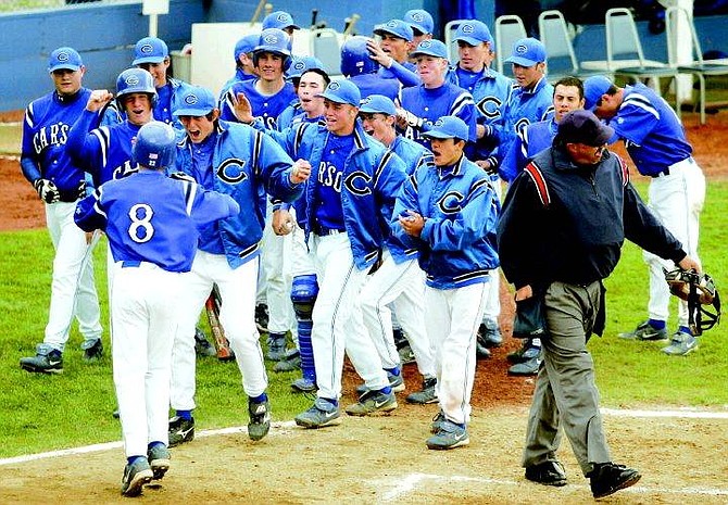 BRAD HORN/Nevada Appeal The Carson High school baseball team clears the dugout to celebrate Brooks Greenlee&#039;s homerun at Ron McNutt Field during the Senator&#039;s game against the Douglas Tigers on Thursday.