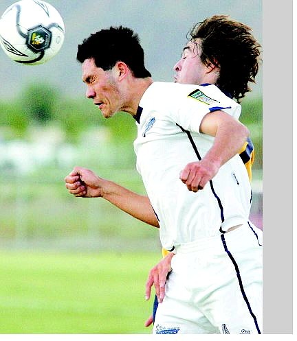 BRAD HORN/Nevada Appeal Carson Wonder David Matein fights for the ball at Carson High School Saturday.