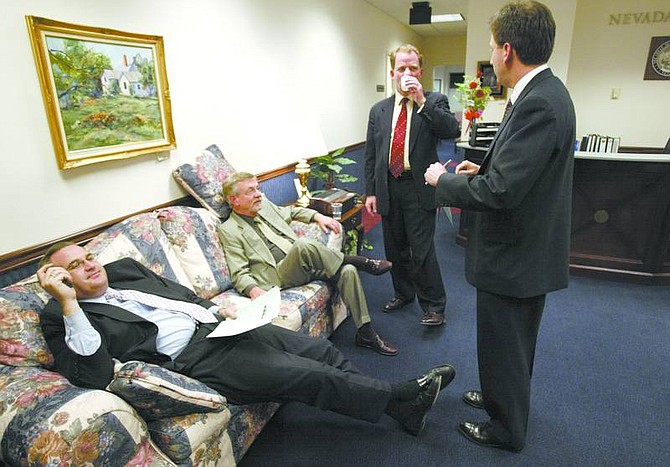 Cathleen Allison/Nevada Appeal From left, Nevada lobbyists Greg Ferraro and Fred Hillerby talk with Chief of Staff Mike Hillerby and state Treasurer Brian Krolicki just before midnight Monday at the Legislature. State lawmakers missed a 1 a.m. deadline Tuesday to finish the legislative session after talks broke down over the proposed changes to the Millennium Scholarship program. After a 10-hour special session, lawmakers were able to conclude the session.