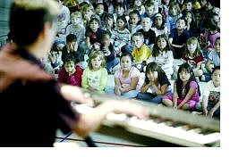 Cathleen Allison/Nevada Appeal Keyboardist Jim Martinez plays for students at Empire Elementary School Monday afternoon as part of a program to educate them about jazz music.