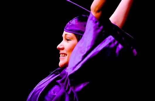 Pioneer High School graduate Kayla Olson gives the victory sign during the  graduation  ceremony at Carson City Community Center on Tuesday.                                 Rick Gunn Nevada Appeal