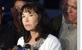 Pam McCoy, mother of murder victim Brian Pierce, listens to a question from the press after making a statement about the postponement of the execution of her son&#039;s killer Robert Lee McConnell. McConnell was to receive a lethal injection at the Nevada State Prison on Thursday evening.   Rick Gunn/Nevada Appeal