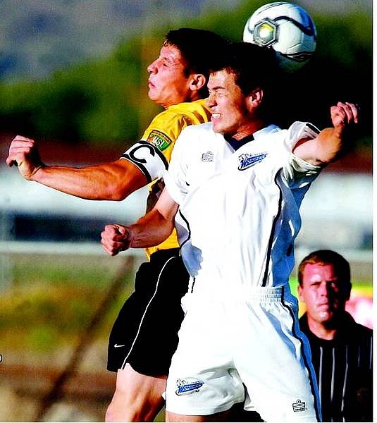 Nevada Wonder&#039;s defender David Martin, right, battles for the ball against California Golf forward Dylan Bradley during their game at Carson High School in Carson City, Nev., on Saturday, June 11, 2005. AP Photo Brad Horn/Nevada Appeal