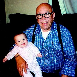 Submitted photo Former businessman Harold Sellers died Friday, only a few days before his 73rd birthday. In this 2003 photo, he holds his great-granddaughter Kaydee Rodenwald, 6 months old.