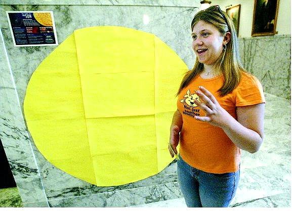 Cathleen Allison/Nevada Appeal Christina Connell, 13, explains her solar system school project that is displayed around Carson City. The sun is at the Capitol, and the other planets are around the city.