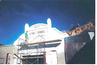 Photo by Carol Clifford Virginia City resident and Mark Twain Bookstore owner Joe Curtis hand lettered the portal facade on July 29, 2001. The 1888 date refers to the original date the facade was erected. The tunnel was completed on July 8, 1878.