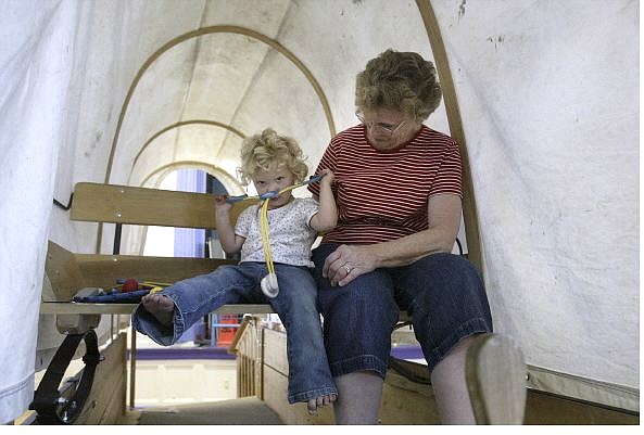 Cathleen Allison/Nevada Appeal Joann Hasting plays with her granddaughter Josie, 2, in the covered wagon display at the Children&#039;s Museum of Northern Nevada recently.