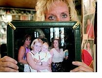 Kevin Clifford/Nevada Appeal Charlett Fortner holds a picture of her daughter Christiana Crowder before she was killed in a car accident.  Crowder&#039;s funeral costs were paid by an anonymous person, which totalled more than $10,000.