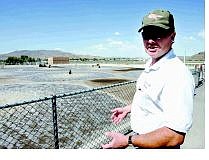 Chad Lundquist/Nevada Appeal Wastewater Operations Supervisor Fred Howard checks on one of the secondary-treatment ponds at the waste water reclamation plant on Wednesday afternoon.