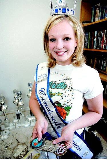 Chad Lundquist/Nevada Appeal Nevada State Cinderella Scholarship Pageant winner Sarah Ricks, 21, of Carson City  shows some of her awards from past pageants. Ricks is now at the national pageant in Las Vegas.