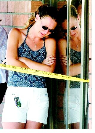 BRAD HORN/Nevada Appeal A neighbor of Shelly Hachenberger&#039;s reacts near the crime scene at 2076 Hawaii Circle after it was reported by the Carson CIty Sheriff&#039;s Office that Chris Rasmussen killed Hachenberger by shooting her multiple times. He then killed himself.