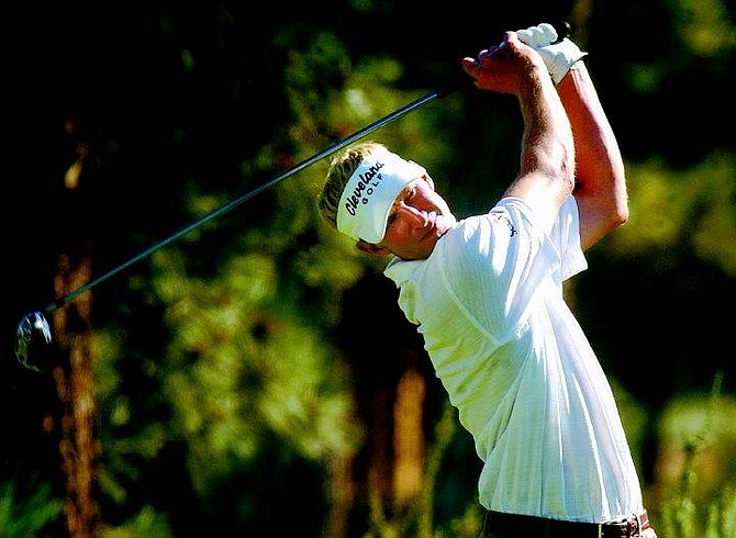 Reno-Tahoe Open defending champion Vaughn Taylor hits off the 18th tee during the Reno-Tahoe Open at Montreux Golf &amp; Country Club in Reno, Nev., on Saturday, Aug. 20, 2005. Taylor shot an 8-under-par 64 to bring his three-day total to 21-under-par and a six-stroke lead going into Sunday&#039;s championship. AP Photo Brad Horn/Nevada Appeal