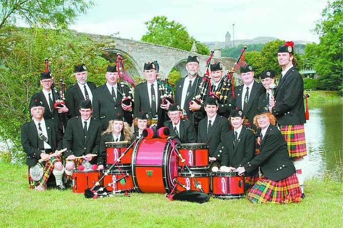 Ron James/For the Nevada Appeal The Sierra Highlanders Pipe Band poses in front of the Stirling Bridge in Stirling, Scotland. The band participated in the World Competition of Pipe Bands in Glasgow, Scotland, recently doing better than five Scottish bands, two U.S. bands and a Canadian band, and placed 12th out of 22 in the ensemble category. Below, members of the Sierra Highlanders Pipe Band pose at the Stirling Clocktower.  From left, front row, are Larry Hoskins, John LoGiurato; back row are Joe LoGiurato, Claire Hoskins and Jeremiah James.