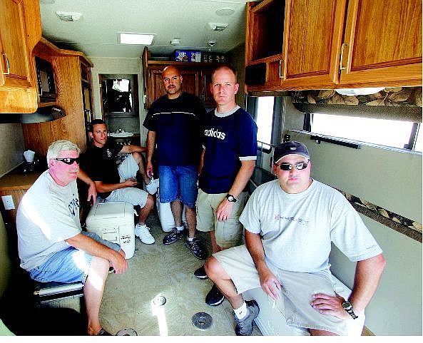 BRAD HORN/Nevada Appeal Carson City Undersheriff Steve Albertson, from left clockwise, deputies Cody Della Bitta, Jose, Gomez, Don Gibson and Dan Ochsenschlager, sit in the trailer they will be living in before their departure to the Gulf Coast.