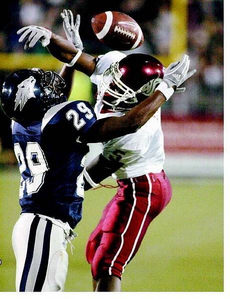 Nevada defender Roderick Stallings breaks up a pass play against Washington State&#039;s Michael Bumpus Friday night, Sept. 9, 2005 in Reno, Nev. (AP Photo/Nevada Appeal, Cathleen Allison)