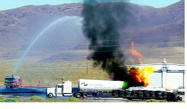 Howard Salmon/Appeal News Service Firefighters attempt to control a fire on a liquified natural gas truck near Fernley on Wednesday.