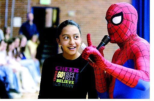 Cathleen Allison/Nevada Appeal Virginia City Middle School seventh-grader Ilse Saldana answers trivia questions for Spiderman as part of an educational program about bullies Friday morning.