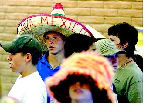 BRAD HORN/Nevada Appeal Ean Witter, 13, in sombrero, and his friend Jeff Barreto, 13, to left, donated $1 toward the Hurricane Katrina relief efforts in the Gulf Coast in exchange for being able to wear a hat to Eagle Valley Middle School on Friday.