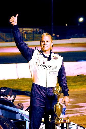 Troy Regier, driver of the S&amp;S Motorsports supermodified, gives a thumbs up to the crowd after winning the annual Harvest Classic at Madera Speedway in Madera, Calif. Saturday night. Regier also won the 2005 championship for the Supermodified Racing League. Photo by Jack Rhyne