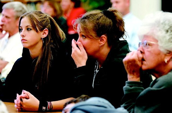 Chad Lundquist/Nevada Appeal Lisa Brooks, 38, center, reacts to a video about methamphetamine abuse on Tuesday night during the first of a three seminars entitled &quot;Get the Facts about Methamphetamine.&quot; About 25 people attended the seminar at Bordewich/Bray Elementary School, including Brook&#039;s daughter Susan, 13, left, and her mother Lucy Garman, right.