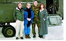 Submitted photo The Stewart family stands by a Chinook helicopter prior to Sgt. Patrick Stewart&#039;s deployment to Afghanistan. Pictured, from left, are Steve, Sandy, Patrick and Roberta Stewart.