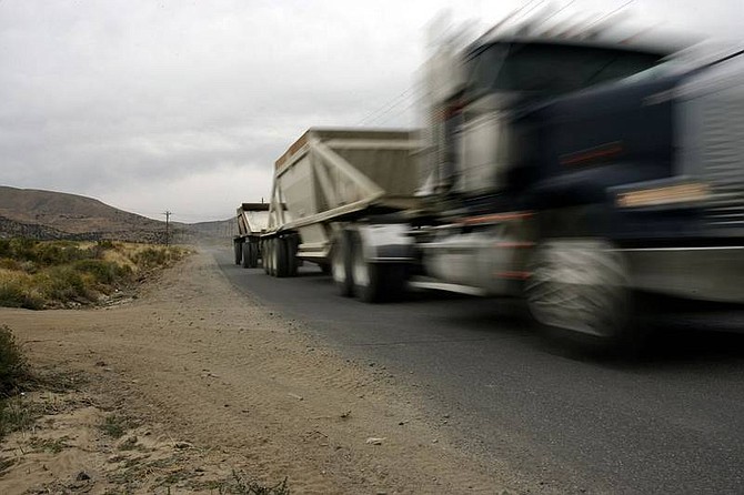Chad Lundquist/Nevada Appeal  A dump truck travels down Linehan Road on Tuesday where residents fear a proposed residential development will add traffic problems in the primarily rural and industrial area.