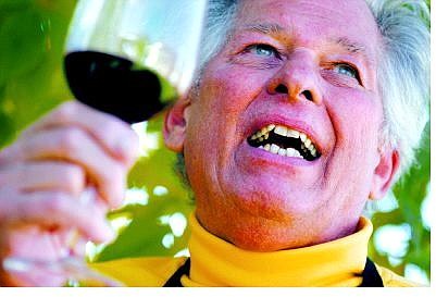 Brian Sokol/Nevada Appeal Gene Donner swirls a glass of fine cabernet sauvignon at his home in Carson City.