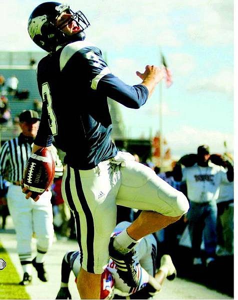 Nevada Wolf Pack quarterback Jeff Rowe reacts after scoring a touchdown against the Louisiana Tech Bulldogs at Mackay Stadium in Reno, Nev., on Saturday, Oct. 15, 2005. The junior quarterback ran for two touchdowns in Nevada&#039;s 37-27 victory. AP Photo Brad Horn/Nevada Appeal