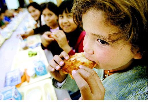 Serenity Amador, 9, eats lunch with her friends at Empire Elementary School Thursday afternoon.