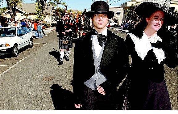 BRAD HORN/Nevada Appeal Mary Bennett, right, walks with Adam Machart, during the funeral procession for Abe Curry during the Ghost Walk in downtown Carson City. Bennett portrayed Mary Curry while Machart played the part of his son.
