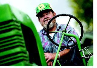Chad Lundquist/Nevada Appeal Gary Graeber, 64, sits atop his 1939 John Deere Model L tractor, at his home in Carson City. Graeber will be at the Nevada Railroad Museum all day today with his son, Jason, and other members of the Northern Nevada Antique Power Club.