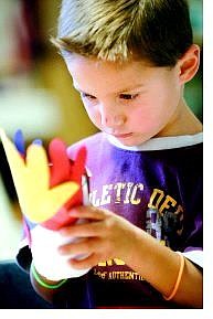 Diego Lopez, 4, of Carson City makes a turkey Tuesday morning at the Children&#039;s Museum of Northern Nevada. The Books and Brags program is held at the museum every Tuesday, and includes storytime and crafts. Cathleen Allison/Nevada Appeal