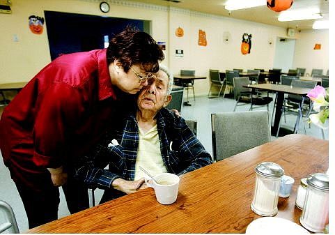 Cathleen Allison/Nevada Appeal Kathy Richardson, office manager of the Dayton Parkview Adult Residence, hugs Carl Carbajal, 93, Wednesday afternoon. The final two residents, out of 54, will be gone by Friday after the facility was forced to close.