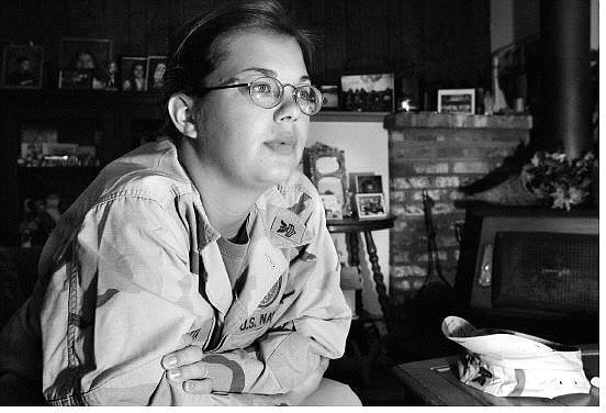 Chad Lundquist/Nevada Appeal Amy Alotta, 25, an enlisted Navy Personnel sits at her parents home on Sunday and talks about experiences during her six years of service in the U.S. Navy. Alotta, who has seen the persian gulf and Guantanamo Bay and was in New York on Sept. 11, is ready to return to the slow speed of Civilian life early next year.