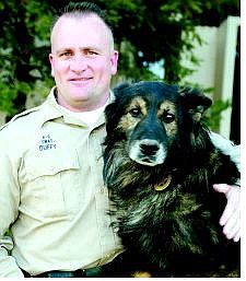 Douglas County Sheriff&#039;s Sgt. Joe Duffy with his dog, Kilo, who is credited with tracking down a suspect in a Minden bank robbery.  Shannon Litz/Nevada Appeal News Service