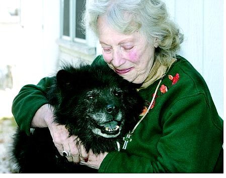 Cathleen Allison/Nevada Appeal Doris Rice hugs her 11-year-old dog, Taz, Wednesday after being reunited with him.