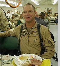 CW4 Daniel Walters, 39, from Genoa, sits down to a turkey dinner Thursday in Kandahar, Afghanistan where he is stationed with the Nevada National Guard Delta Company, 113 Aviation unit.   provided to the Nevada Appeal