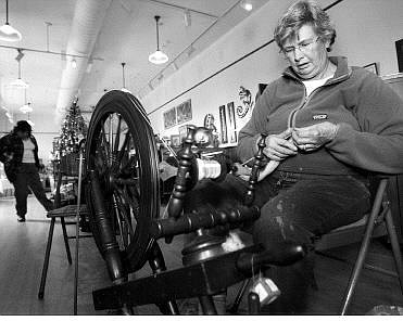 Chad Lundquist/Nevada Appeal Marilynn Clarke of Reno, spins wool into yarn on a spinning wheel at Brewery Arts Center during The Artisans&#039; Store annual holiday open house on Sunday.
