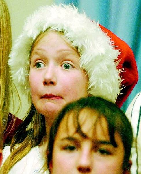 BRAD HORN/Nevada Appeal Miranda Callahan, 10, of Bordewich Bray Elementary School, sings with the Carson City Fifth-Grade Students Singing Musical Ensemble during the Silver &amp; Snowflakes 2005 Traditional Christmas Tree Lighting at the Nevada State Capitol on Thursday.