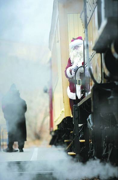 Chad Lundquist/Nevada Appeal Santa Claus prepares to dismount the train Sunday during the 18th annual Santa Train at the Nevada State Railroad Museum.