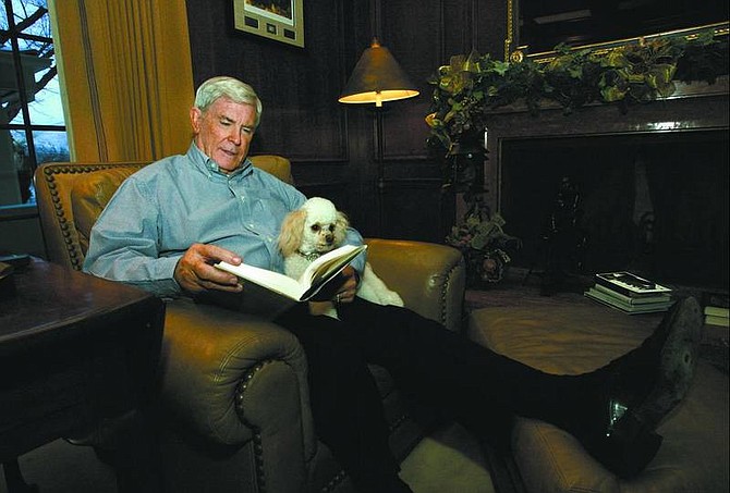 Cathleen Allison/nevada appeal Nevada Gov. Kenny Guinn relaxes in his den at the Governor&#039;s Mansion in Carson City on  Dec. 9 with his dog &quot;Mimi.&quot; Guinn is in his final year as governor after serving two terms and is looking forward to touring the state with his wife Dema.