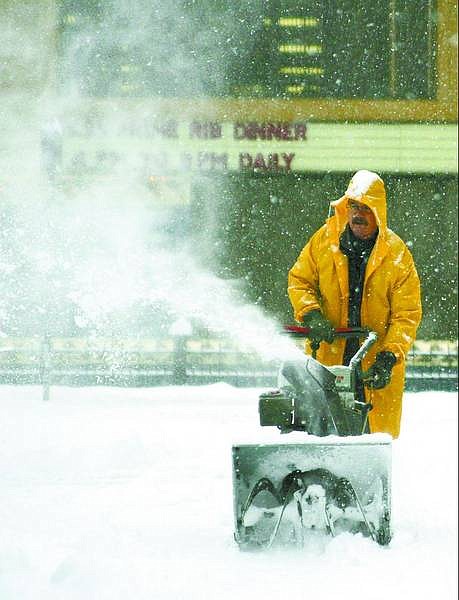 Brad Horn/Nevada Appeal Ron Kaher, an employee of Cactus Jack&#039;s Casino in Carson City. plows a side street in front of the casino during a snowstorm on Sunday. A fast-moving front brought more than 8 inches of snow in less than 12 hours.
