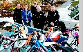 Rich Johnson/Special to the Nevada Appeal Capitol Police officers and Wal-Mart combined efforts to donate 14 bicycles to the Eagle Valley Children&#039;s Home. From left, Capitol Police Cpl. Randy Smith, Donna Clarke of the Eagle Valley Children&#039;s Home, Cpl. Sam Logan, Officer Robert Gagen and Chief Brad Valladon.