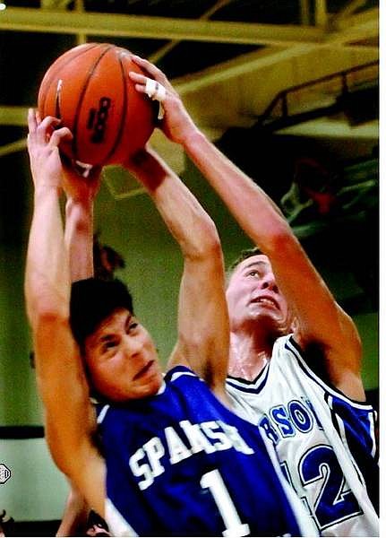 Kevin Clifford/Nevada Appeal Carson Senators Foward Steve Manoki fights with Spanish Springs Cougars Guard Giovanni Beltran for a re-bound at the Carson Classic Thursday, Dec. 22, 2005.  The Carson Senators advanced to the final round with the defeat of the Cougars.