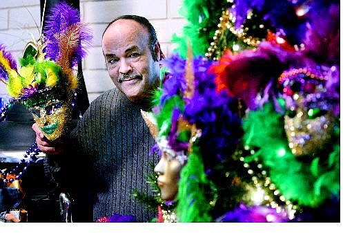 Cathleen Allison/Nevada Appeal Charles Adams shows off his Mardi Gras Christmas tree, decorated to remind people of the spirit of New Orleans.
