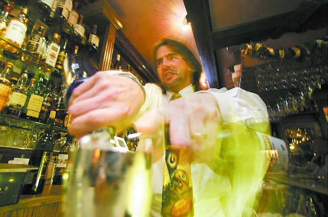 BRAD HORN/Nevada Appeal Mark Nadreau mixes a vodka martini at the Adele&#039;s Restaurant Bar in Carson City on Wednesday.